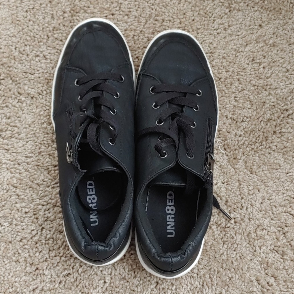 UNR8ED Women's black loader sneakers.